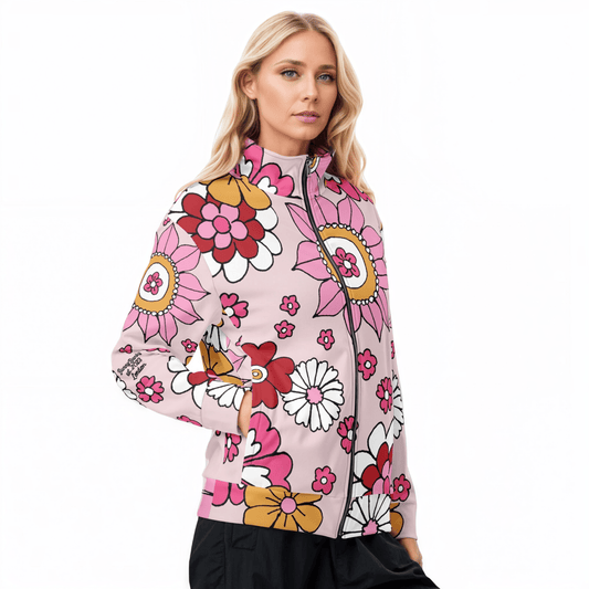 A model wearing The Primrose Hill Track Jacket, showing the lightweight fit and the vibrant pink and yellow oversized floral print.