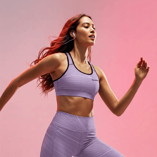 BunnyBankY AI proprietary model wearing the Roma Performance Bra, highlighting the bold "City Babe" text printed on the top left and the dynamic graphic spiral print details, and the matching Roma Sculpt Leggings.