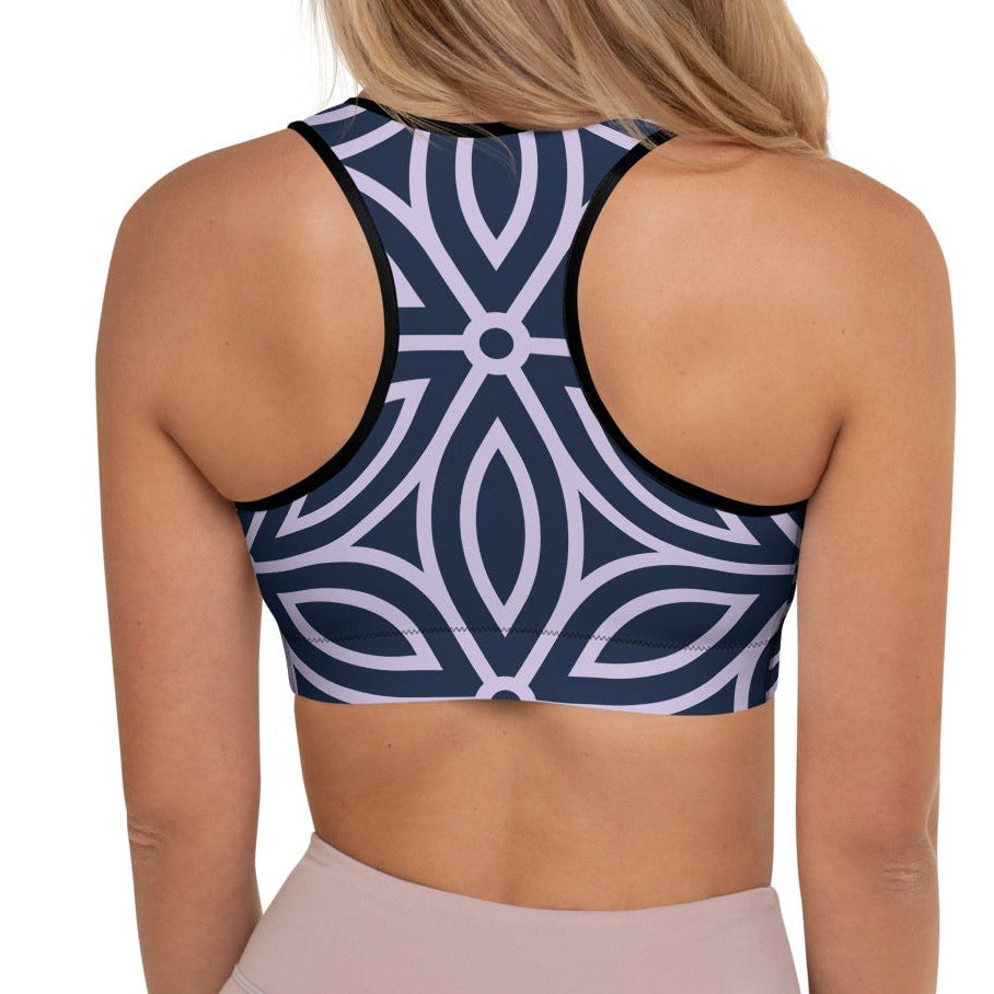 model wearing the Canary Wharf Performance Bra in blue and lilac geometric floral pattern