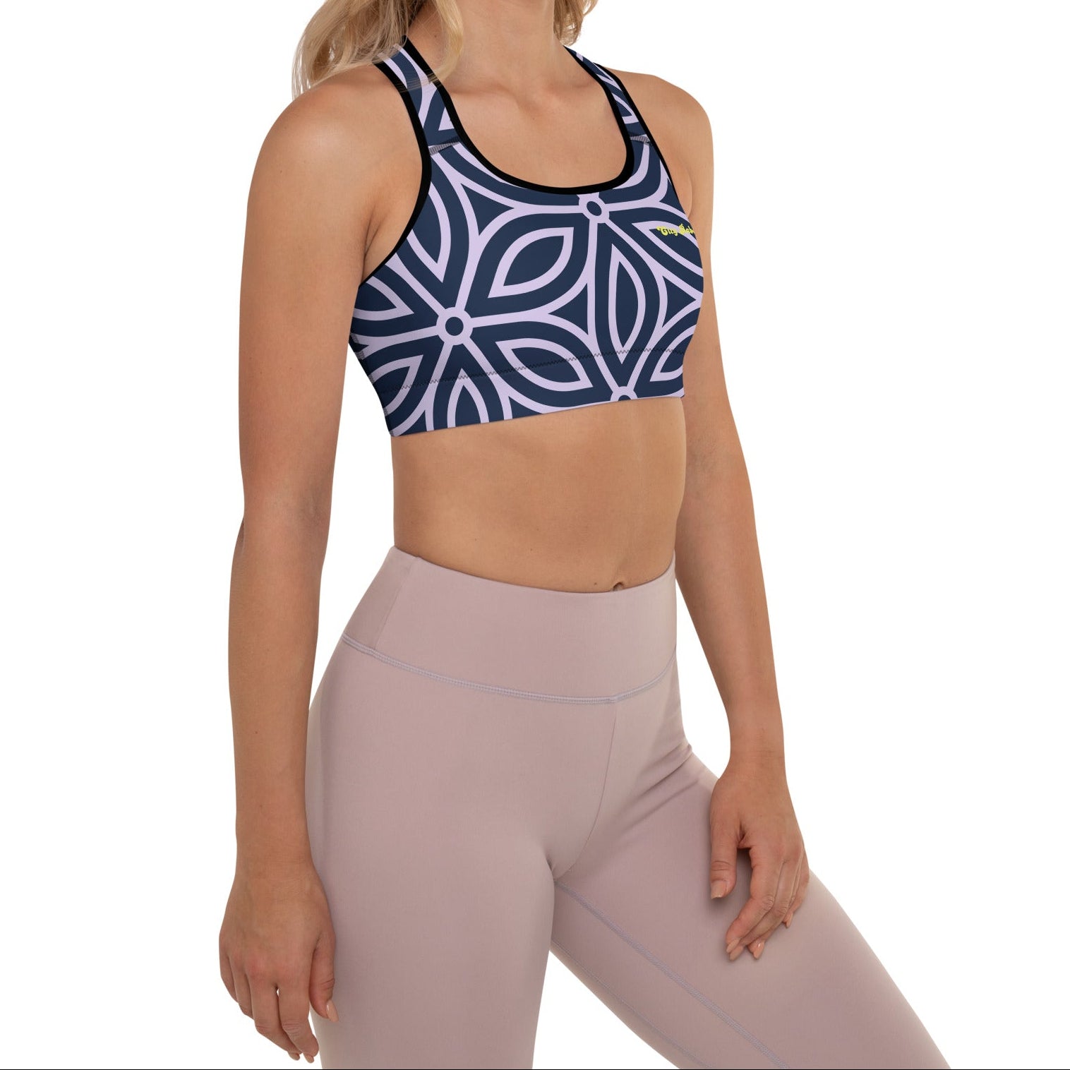 model wearing the Canary Wharf Performance Bra in blue and lilac geometric floral pattern