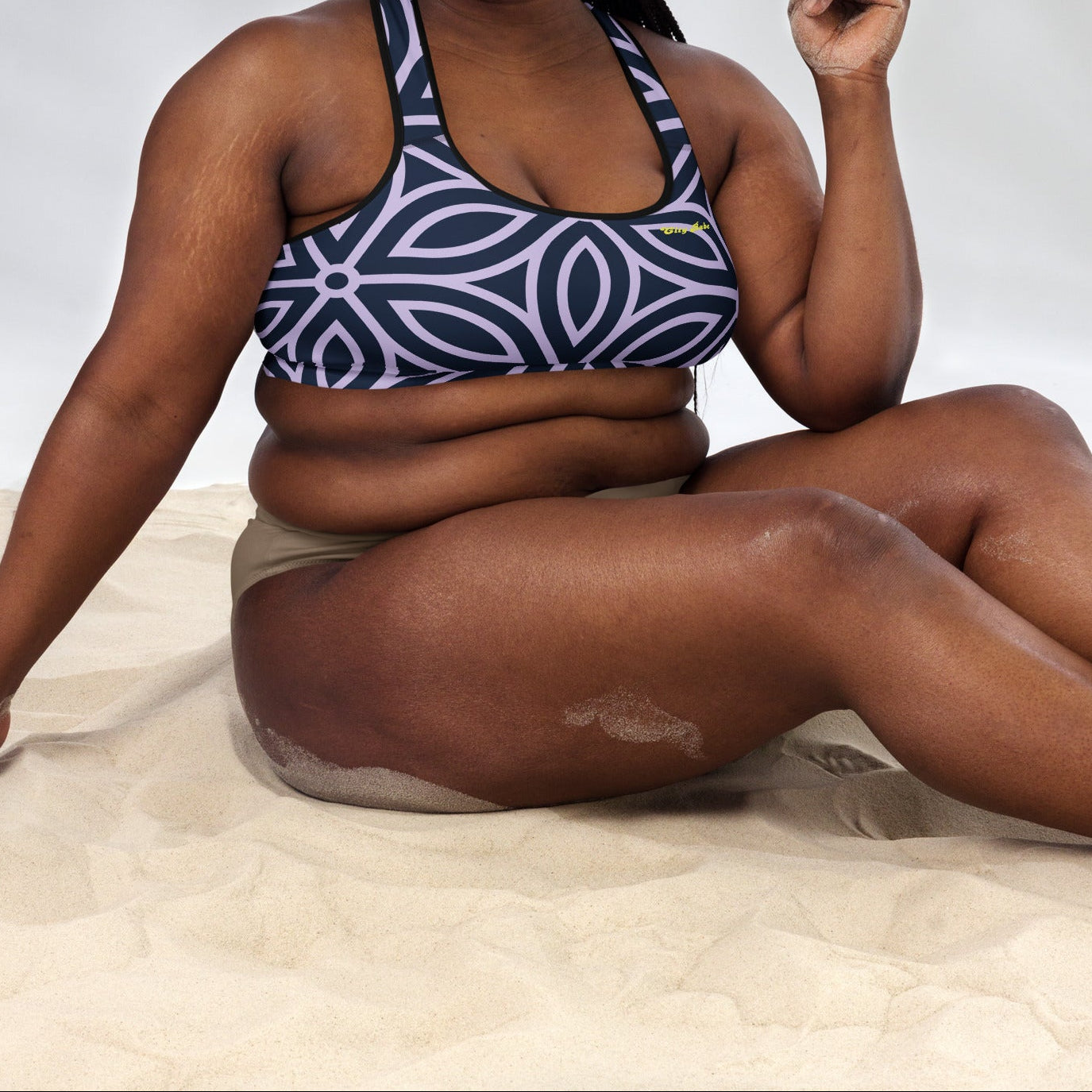 model wearing the Canary Wharf Performance Bra in blue and lilac geometric floral pattern