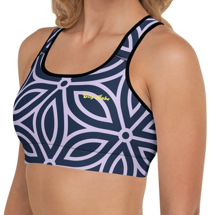 model wearing the Canary Wharf Performance Bra in blue and lilac geometric floral pattern