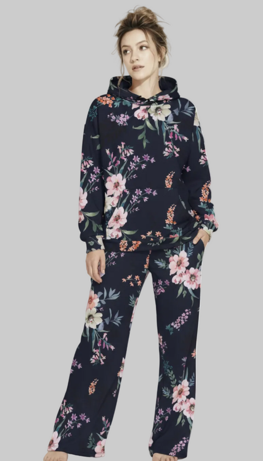 A BunnyBankY AI proprietary model wearing the matching Kew Botanical Set. The image highlights the cohesive floral print across the hoodie and joggers, emphasizing the premium drape of the wide-leg cut.