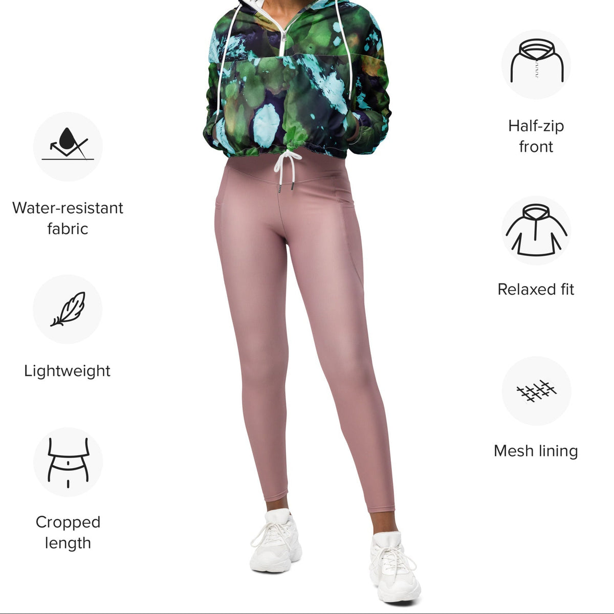 A model wearing The Abstract Crop Shell, showing the high-fashion, cropped silhouette and the abstract expressionism print in green and blue hues.
