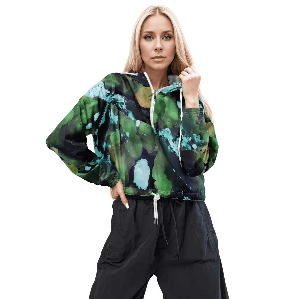 A model wearing The Abstract Crop Shell, showing the high-fashion, cropped silhouette and the abstract expressionism print in green and blue hues.