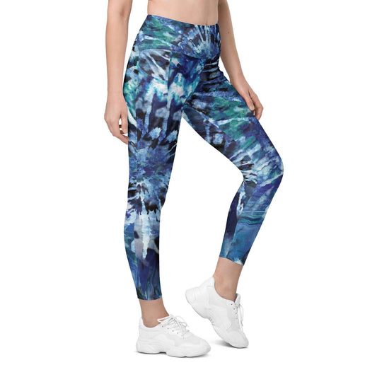 A model wearing The Athens Sculpt Leggings, showing the high-waisted, sculpting fit and the signature blue tie-dye print.