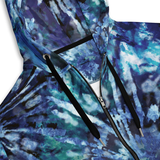 Close-up of the Athens Hoodie's tie-dye blue print and the soft texture of the 95% certified recycled polyester fabric.