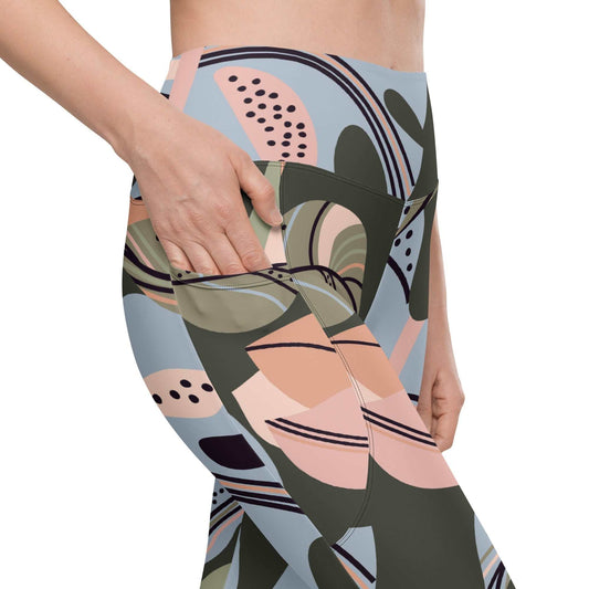 A close-up of The Barbican Sculpt Leggings' elegant, exotic flower print, showing the deep side pocket and the soft, recycled fabric.