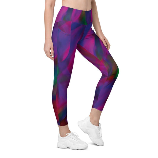 A model wearing The Bologna Sculpt Leggings, showing the high-waisted fit and the vibrant purple, pink, and green graphic print.