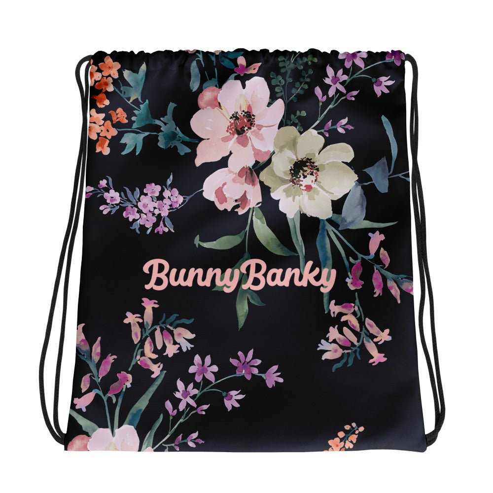 the kew botanical bag featuring a floral print on navy blue fabric.