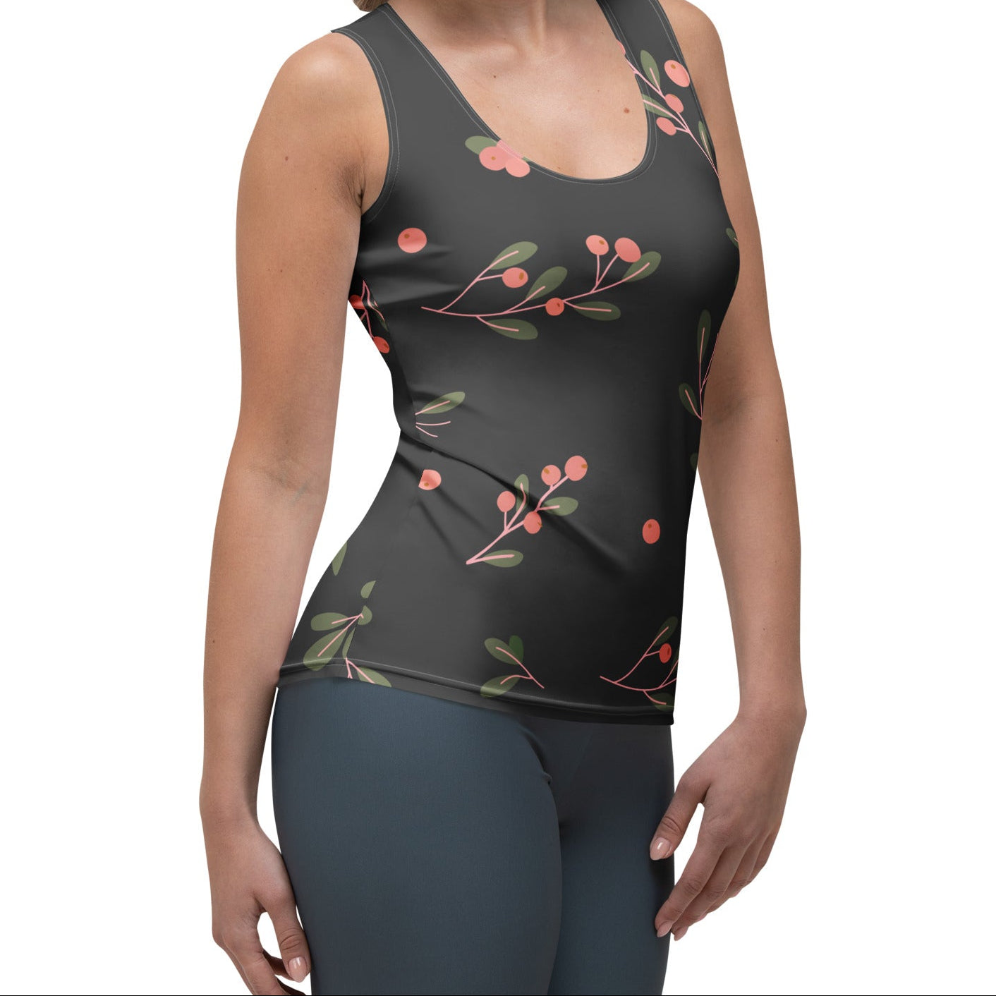 Woman wearing a brown sleeveless top with a decorative pink design on a white background