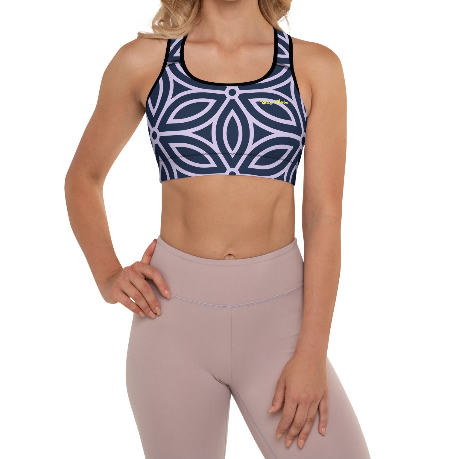 model wearing the Canary Wharf Performance Bra in blue and lilac geometric floral pattern