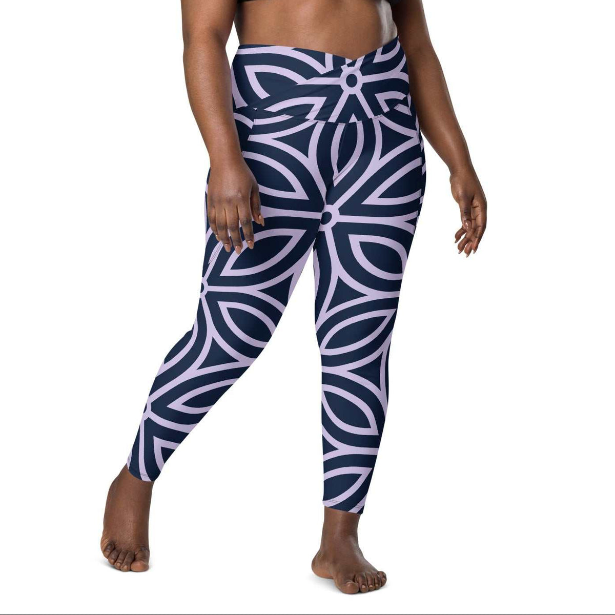 model wearing the Canary Wharf Sculpt Crossover Leggings in blue and lilac geometric floral pattern