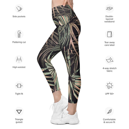 Person wearing tropical leaf pattern BunnyBanky branded leggings on a white background