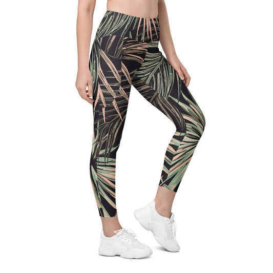 Person wearing tropical leaf pattern BunnyBanky Chiswick Sculpt leggings on a white background