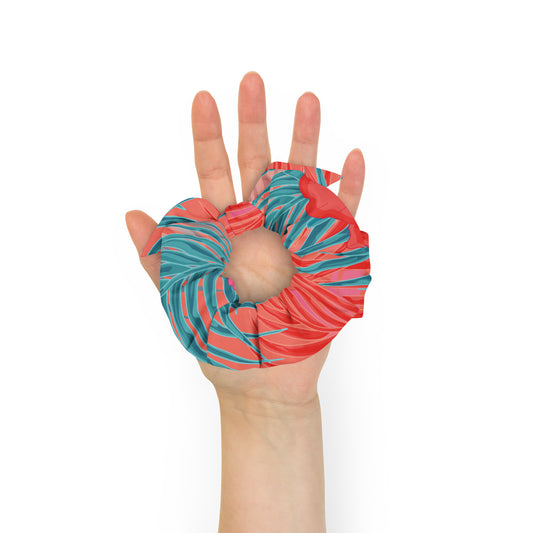 disrtrict tropic scrunchie with a removable bow made from certified recycled polyester in vibrant tropic print in orange and turquoise hues