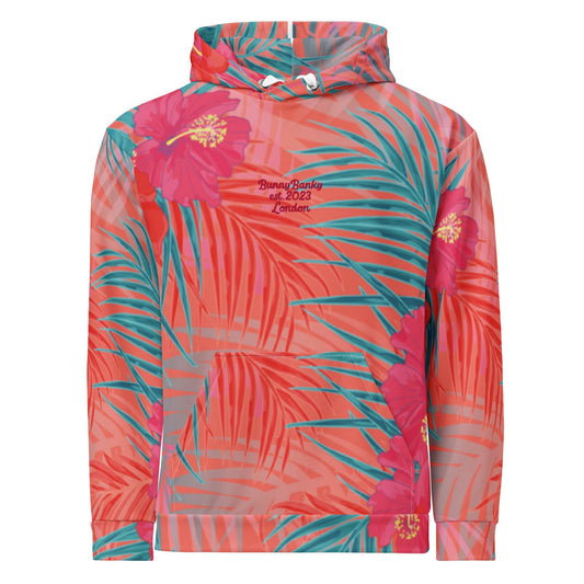 A close up of the BunnyBankY District hoodie highlighting the vibrant pink , orange, and blue colours in a tropical floral print