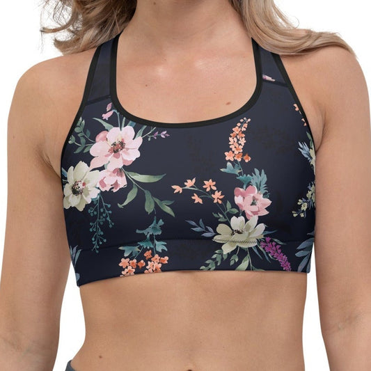 Model wearing the forever folio Glam Bundle, featuring the performance bra in floral print on navy blue fabric.