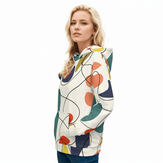 A model wearing The Joie de Vie Hoodie, showing the relaxed, oversized unisex fit and the vibrant Suprematist-inspired geometric print.