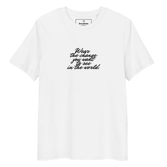 A close-up of The Manifesto Tee, showing the premium organic cotton fabric and the "Wear the change" text.