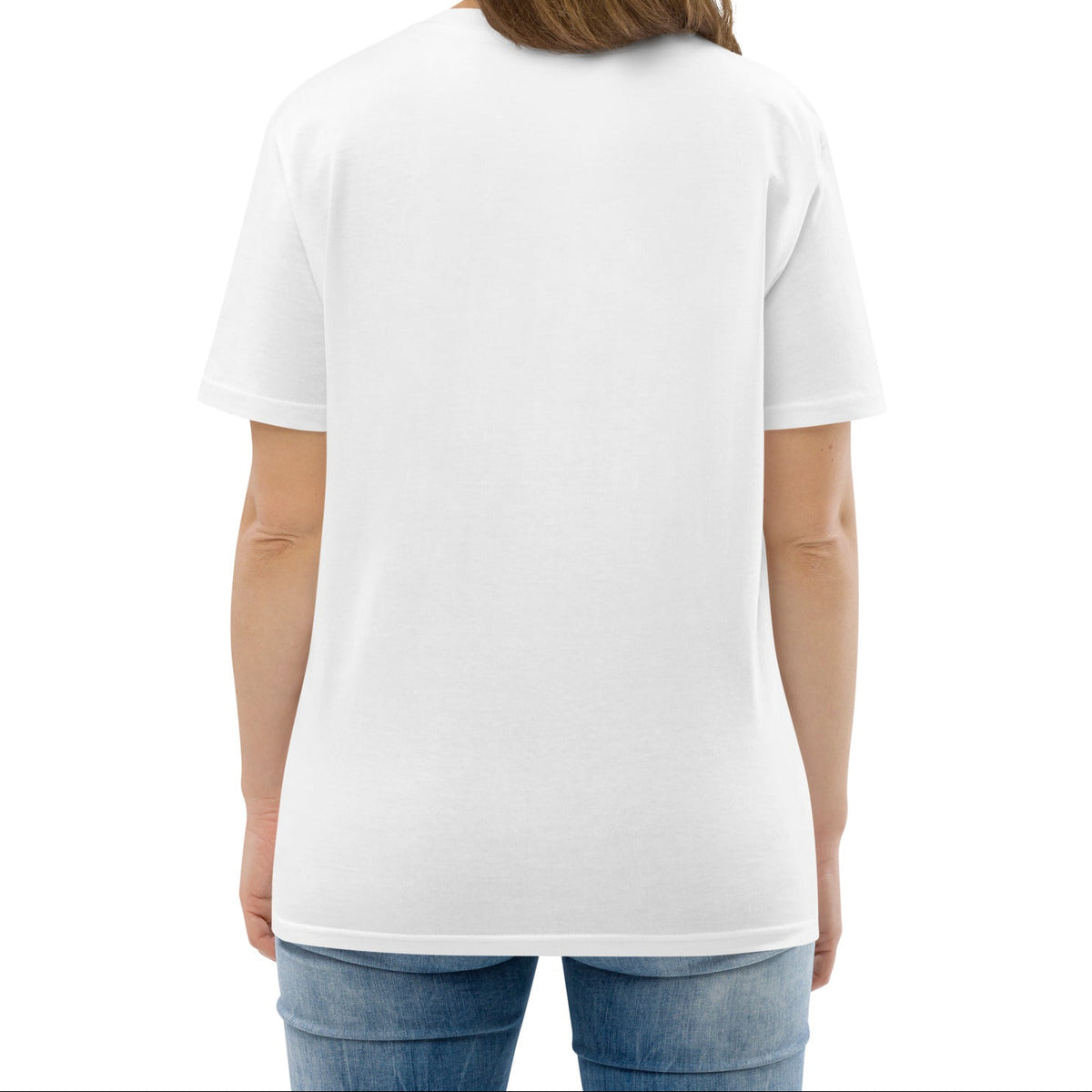 A model wearing The Manifesto Tee in 100% organic cotton, showing the "Wear the change you want to see in the world" text on the front.