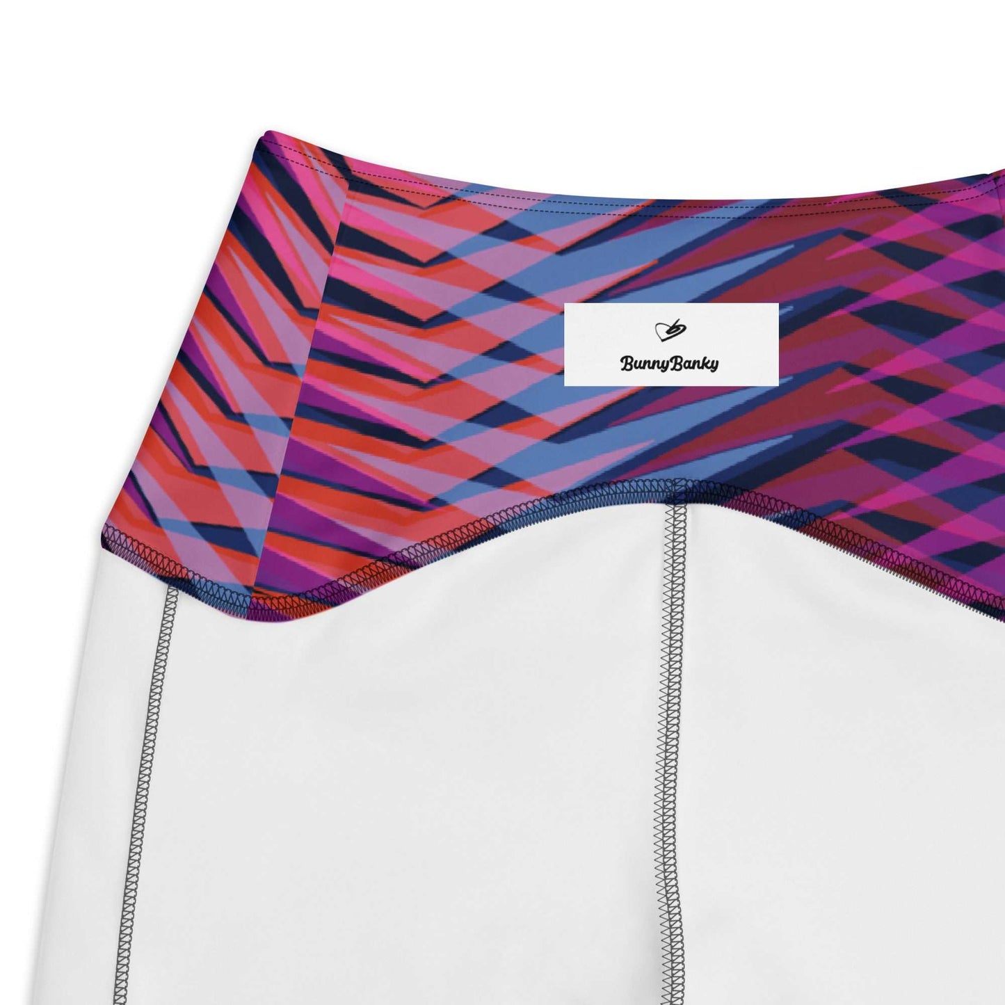 Close-up of The Moorgate Sculpt Legging featuring vibrant pink, orange, purple, and blue dynamic arrow print waistband with BunnyBanky logo.