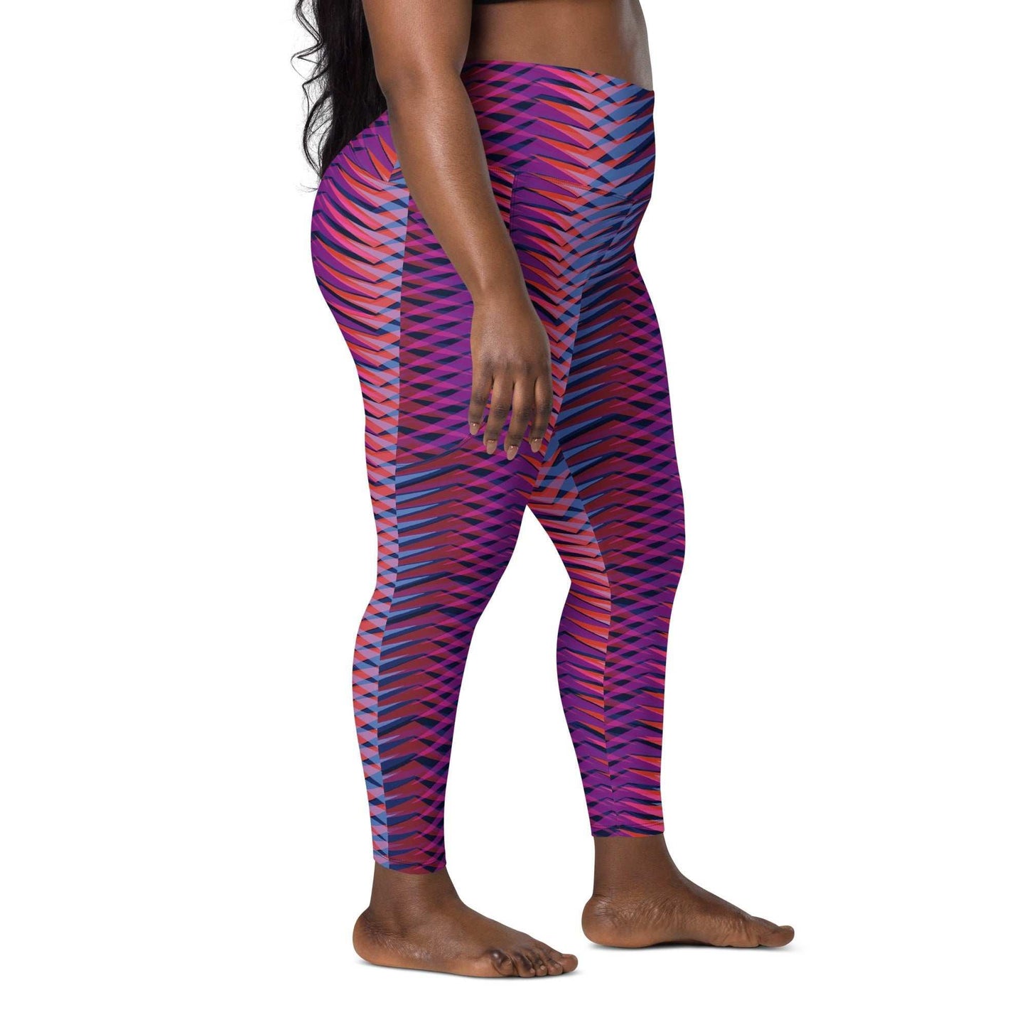 The Moorgate Sculpt Legging with vibrant pink, orange, and blue arrow print, high-waisted mild compression fit, and dual side pockets.