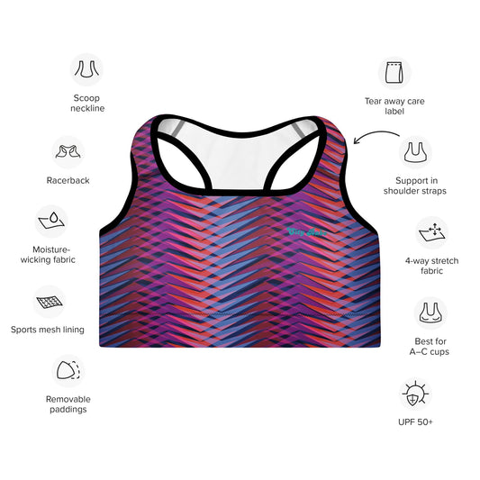 A close up of The Moorgate Performance Bra, showing the supportive fit and the dynamic graphic arrow print in vibrant pink, orange, and blue hues.