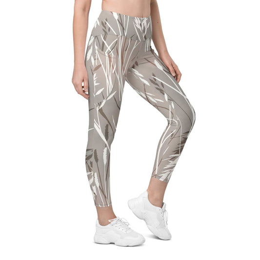 The Osaka Sculpt Leggings in light grey beige with earthy floral brush print, high-waisted, mild compression, and dual side pockets.