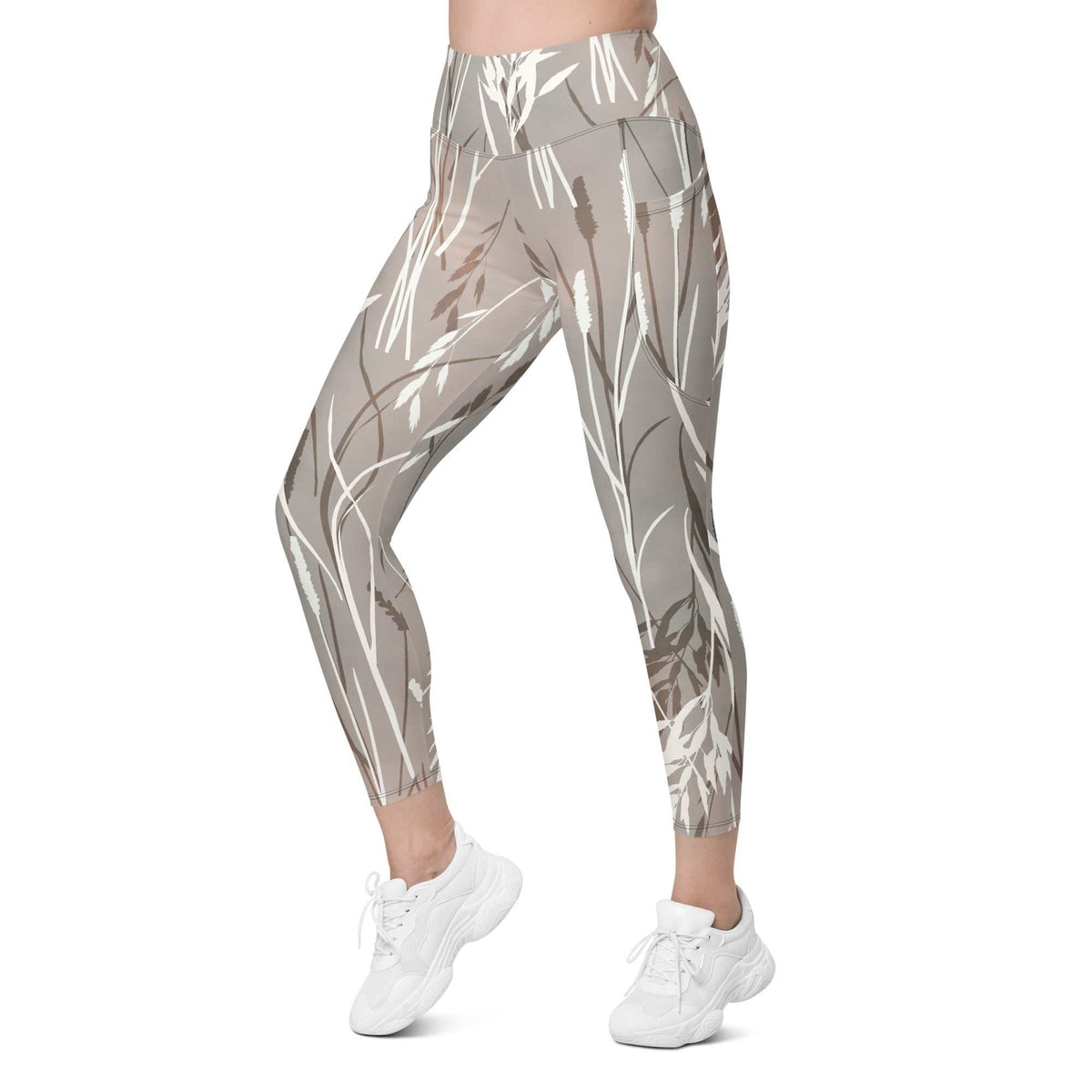 The Osaka Sculpt Leggings in light grey beige with earthy floral brush strokes, high-waisted, soft stretch fabric, dual side pockets, and UPF 50+ sun protection.