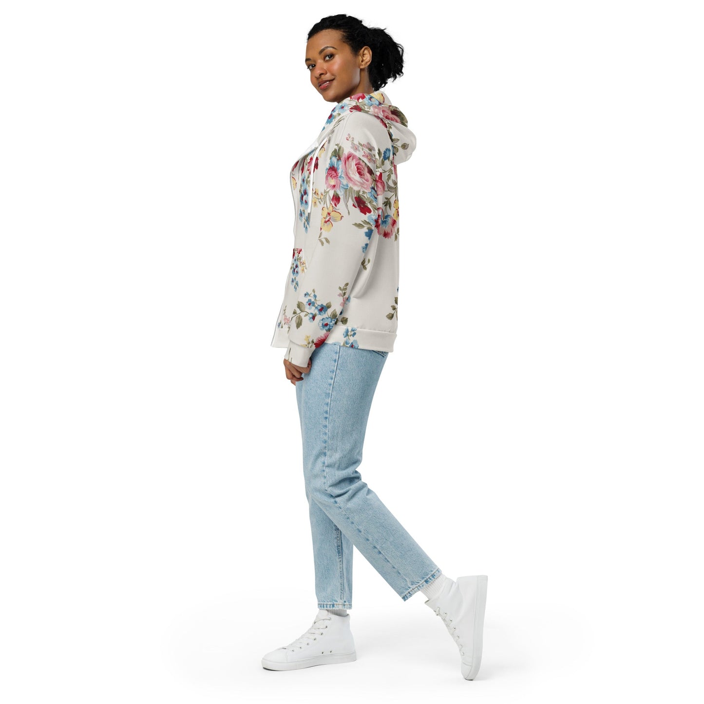 A model wearing The Pink Blush Zip Hoodie, showing the serene pink blush and sky blue floral pattern and the premium fit with metal zipper details.