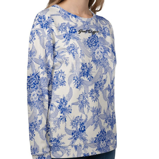 The Saint Germain Sweatshirt, highlighting the "Goal Digger" embroidery on blue floral pattern on cream fabric and the iconic signature logo at the back.