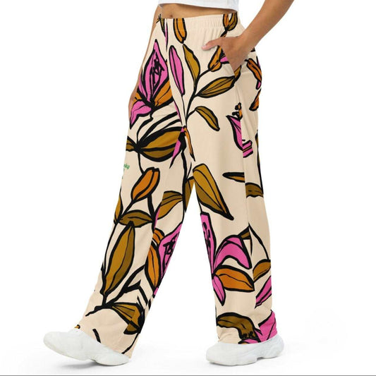 Floral patterned pants worn by a person on a white background