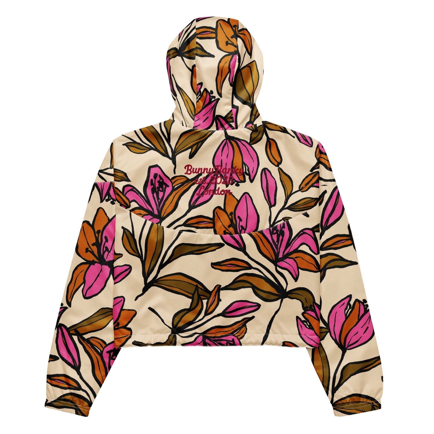 A close-up of The Terra Shell's fabric, highlighting the texture and the vivid bubblegum pink tropical flower print.