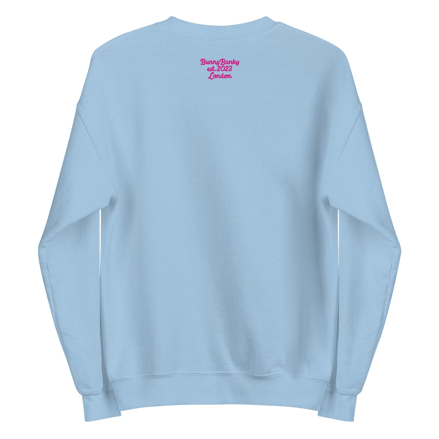 A close-up of The Upgraded Sweatshirt, highlighting the bold Upgraded text embroidered in fuschia on the chest, the soft air-jet spun fabric, and the detailed heritage logo print on the back.