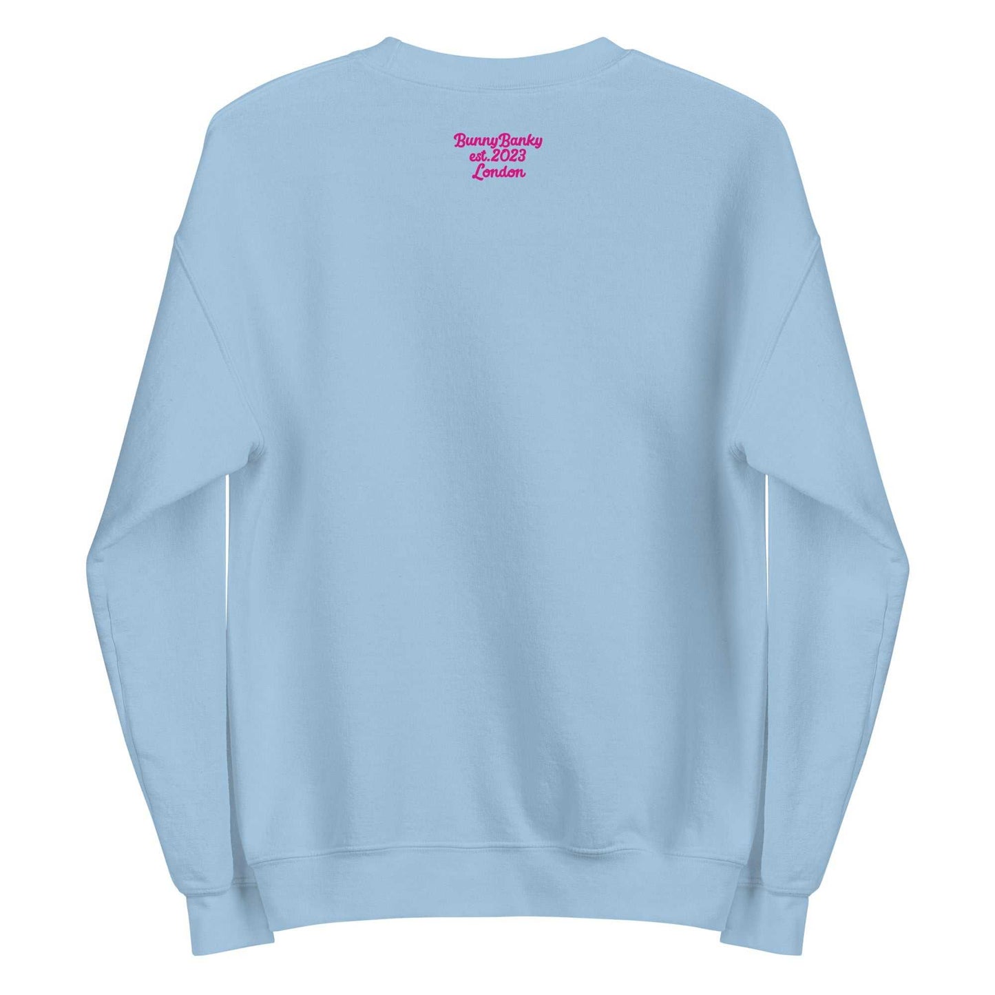 A close-up of The Upgraded Sweatshirt, highlighting the bold Upgraded text embroidered in fuschia on the chest, the soft air-jet spun fabric, and the detailed heritage logo print on the back.