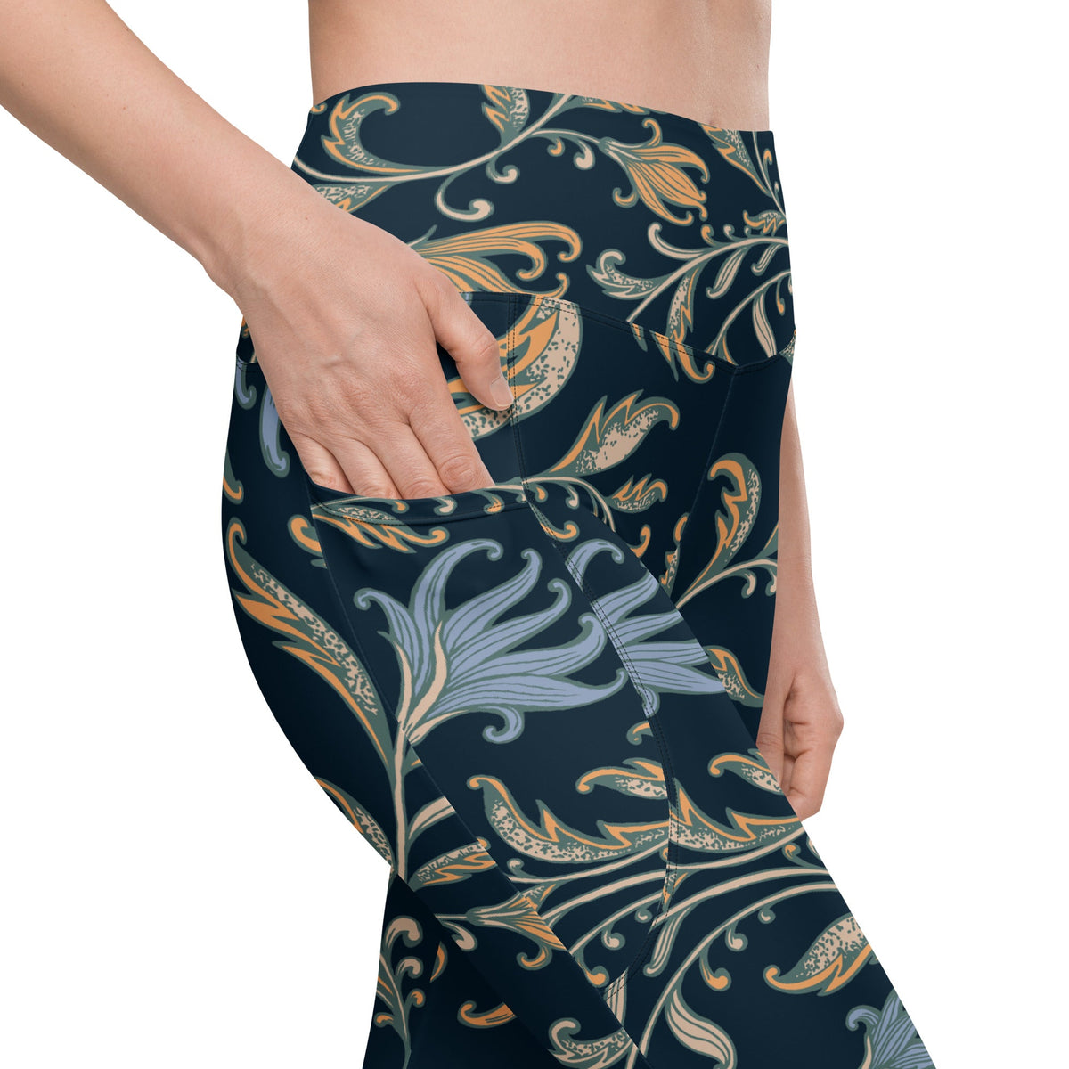 model wearing the Venice high-waisted sculpt leggings featuring an intricate gold and slate-blue floral filigree print over a dark blue base