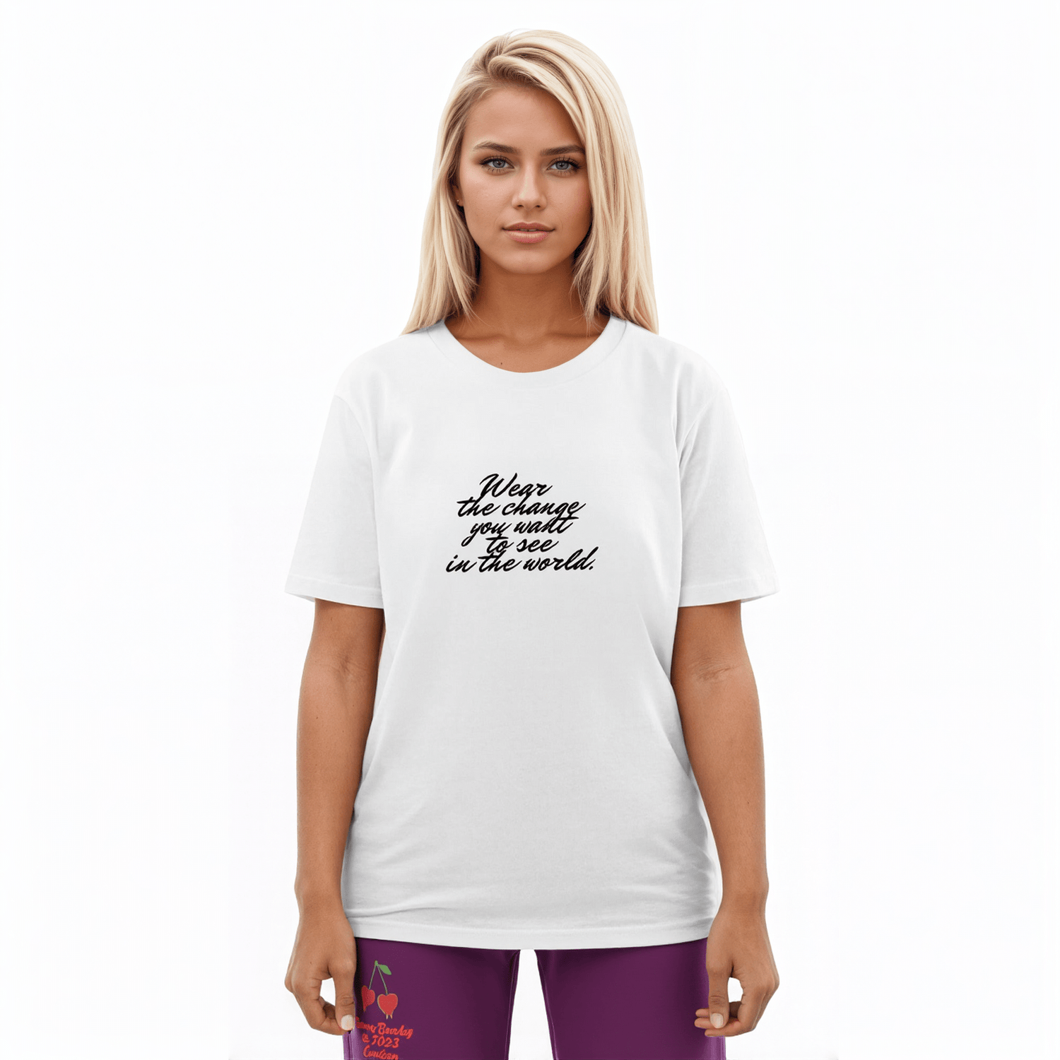 AI Proprietary Model wearing The Atelier Manifesto T-Shirt that displays the text "Wear the Change" with the full-length Tokyo Flow Joggers in purple. Highlights the confident fit and the conscious pairing of the T-shirt with the sustainable joggers.