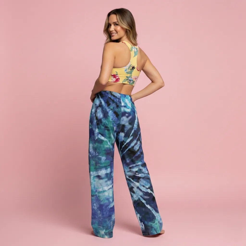 BunnyBankY AI Proprietary Model wearing the Toronto longline performance bra, and Athens Flow Wide Joggers. The set showcases the clashing prints.