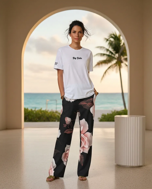 A  BunnyBankY AI model wearing The Big Data Tee in 100% organic cotton, showing the bold "Big Data" text on the front, and the Paris Flow Wide Joggers in pink roses pattern on black recycled fabric.