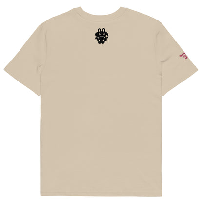 Back view of the BunnyBanky unisex organic cotton t-shirt in desert dust beige, featuring a bold black bunny monster character graphic printed on the center chest, and a smaller one at the back