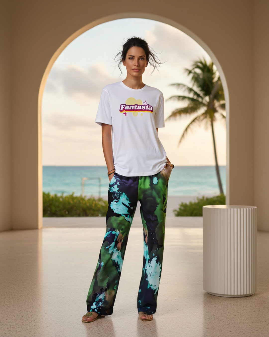 A BunnyBankY AI proprietary Model wearing the Fantasia t-shirt and The Abstract Flow Joggers, showing the wide-leg cut and the abstract expressionism-inspired print in green and blue hues.