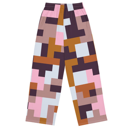 The Marais Flow Joggers. These joggers are high-waisted, wide-leg flowy joggers featuring the distinctive cubism-inspired geometric pattern made of interlocking pink, brown, dark purple, and white rectangular and square blocks. 