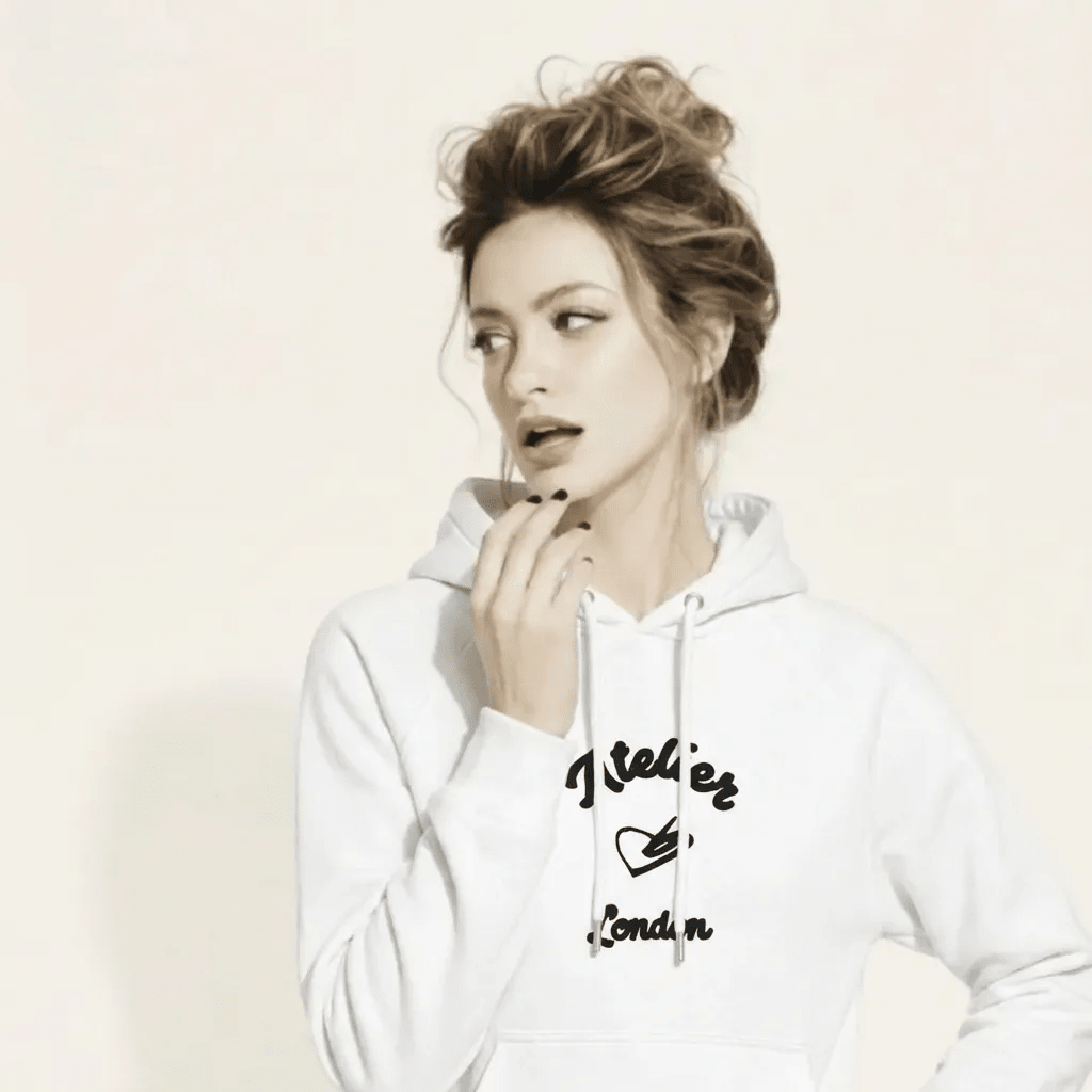 A BunnyBanky AI proprietary model wearing The Atelier Hoodie showing the branded atelier heart logo