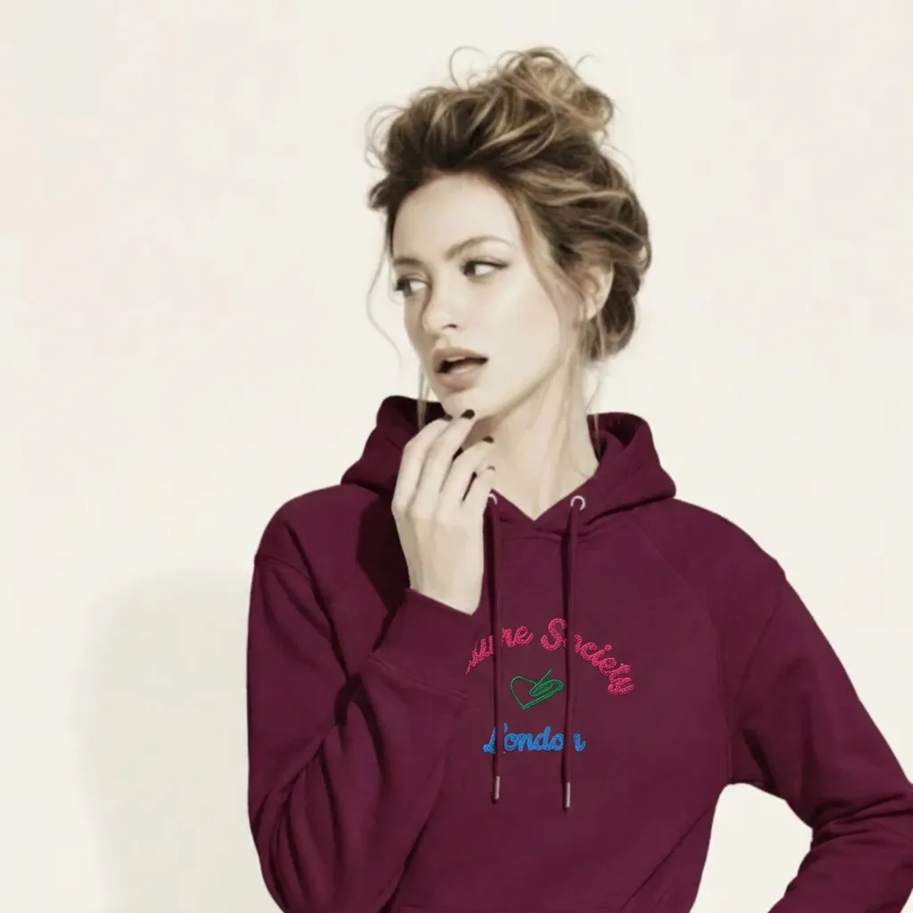 A BunnyBankY AI proprietary model wearing The Geneva Visionary Hoodie, showing the regular fit and the "Future Society" heart logo and London text embroidery on the chest.