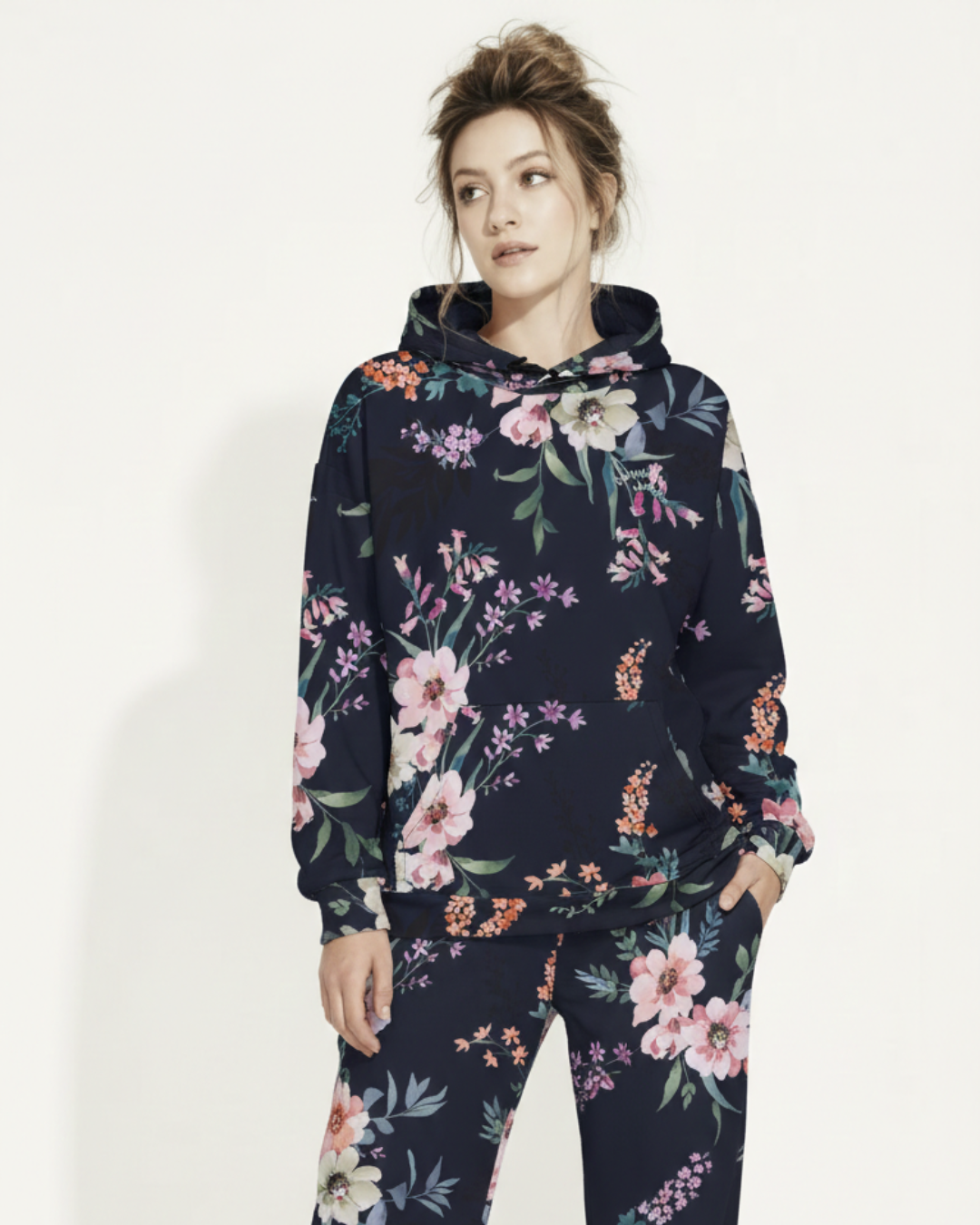 A BunnyBankY AI proprietary model wearing the matching Kew Botanical Set. The image highlights the cohesive floral print across the hoodie and joggers, emphasizing the premium drape of the wide-leg cut.