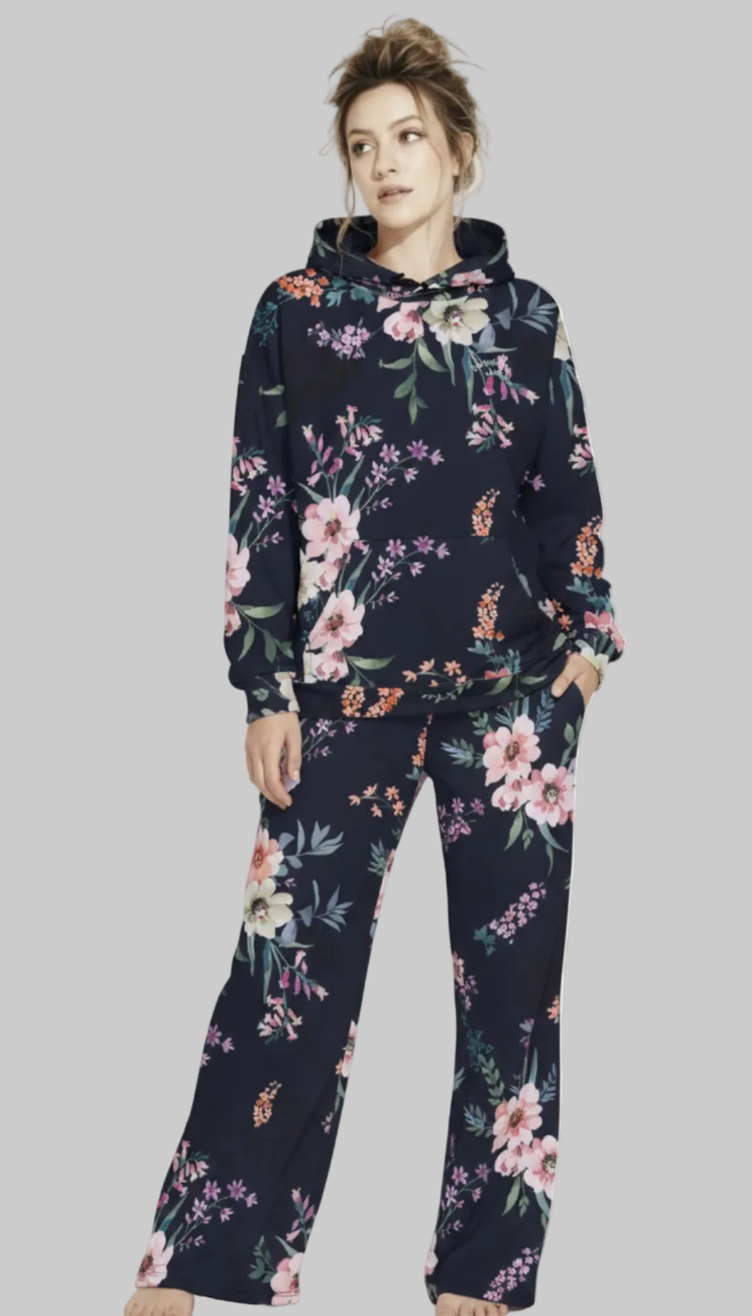 A BunnyBankY AI proprietary model wearing the matching Kew Botanical Set. The image highlights the cohesive floral print across the hoodie and joggers, emphasizing the premium drape of the wide-leg cut.