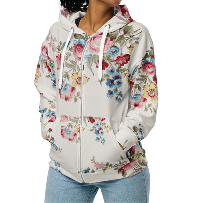 A model wearing The Pink Blush Zip Hoodie, showing the serene pink blush and sky blue floral pattern and the premium fit with metal zipper details.
