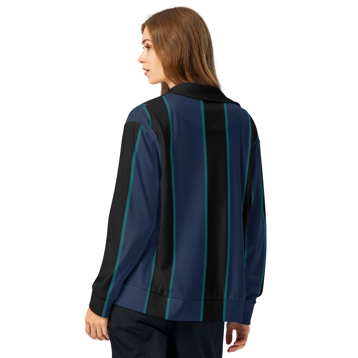 A model wearing The Regent Track Jacket, showing the premium slim fit, full-zip closure, and the vertical green and blue stripe print on the navy background.