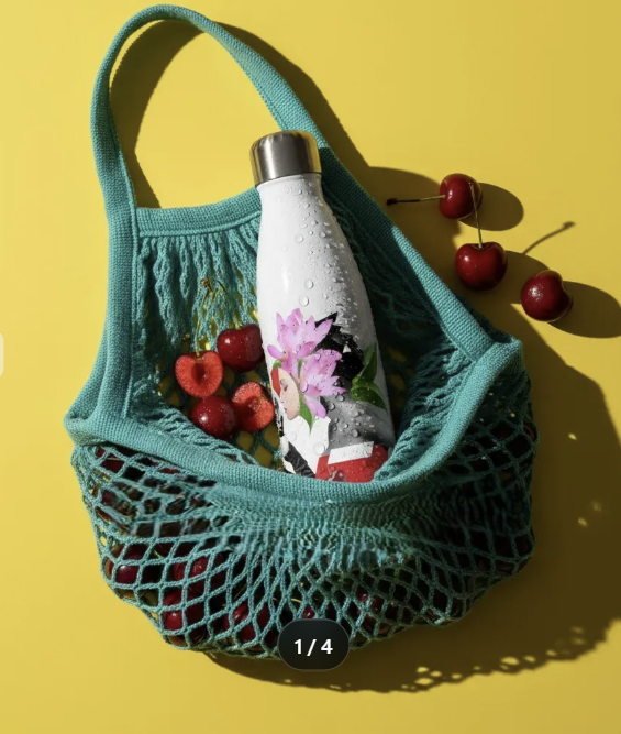 The Atelier Water Bottle, a stainless steel insulated flask with a glossy finish and an exclusive fashion illustration collage print.